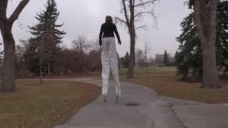 Author and stilt-walker Joan Marie Galat