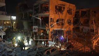 First responders look for survivors after Iranian missile falls near Tel Aviv