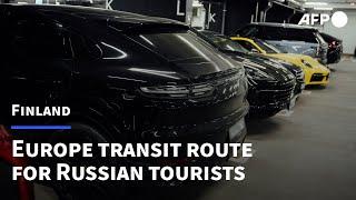 Russian tourists' luxury cars fill up Helsinki airport | AFP