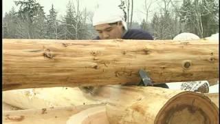 Building log cabin: Saddle notch a log