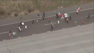 San Diego protesters take over I-5 freeway near Coronado exit