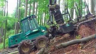 Timberjack 1110D with traction cable on steep slope