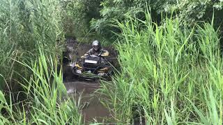 BRP XMR girl on a quad bike in the mud