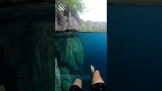 Swimming in crystal clear water at Barracuda lake