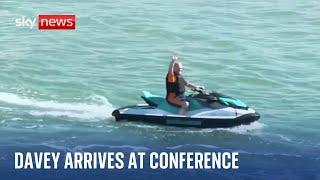 Sir Ed Davey arrives at Lib Dem conference on a jet ski