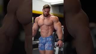 Sexy muscle bull walking through the gym like he own it