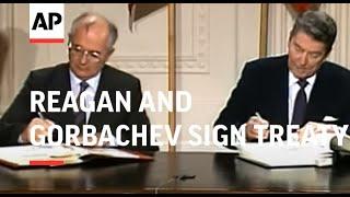 President Ronald Reagan and Soviet Union leader Mikhail S. Gorbachev sign a treaty banning intermedi