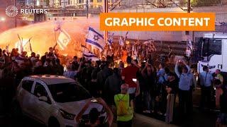 WARNING: GRAPHIC CONTENT - Israel: Cars drive through crowd of protesters in Tel Aviv