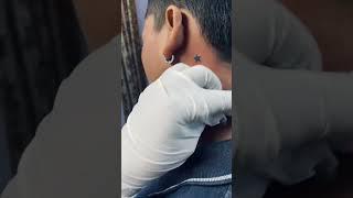 Star tattoo on neck