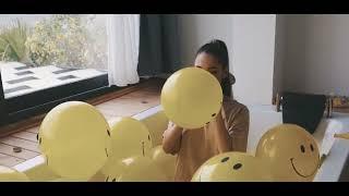 Woman Inflating Balloons