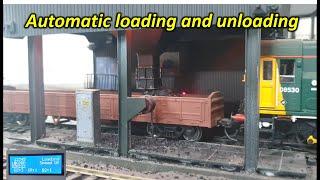 Automatic loading and unloading live loads in HO scale