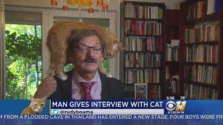 TV Commentator's Cat Climbs Onto His Head During Interview