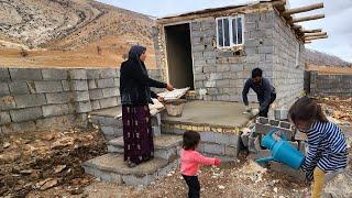 Cement work with love; the commitment and dedication of Nemat and Umm al-Binin in building a house!