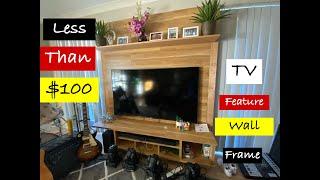 building homemade TV Feature Wall Frame using laminate floor planks and hide the wires