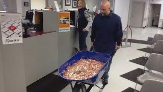 Man Pays Nearly $3,000 Bill Using A Wheelbarrow Full Of Pennies