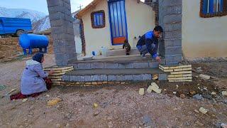 "Cementing the roof of the porch of Muhammad's house with the help of Rafiq and his brother Abu"