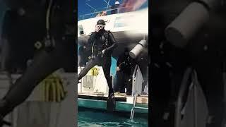 Frogwoman In Skintight Rubber Wetsuit Jumping In