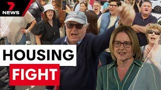 Furious locals target the premier over her plan to build housing towers in 50 neighbourhoods | 7NEWS