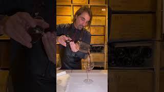 This process is called 'Priming' or 'Seasoning' the wine glass.