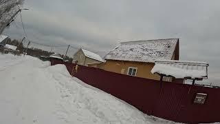 Gravel bike on deep snow. Village, forest, skiers. Part 2.