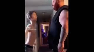 Big guy slaps tiny guy