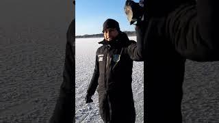 Preparing to dig a hole in a frozen lake...yes for you guessed it, an ice bath