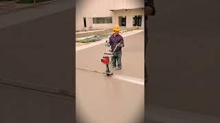 the process of leveling and compacting concrete surfaces using modern tools #shorts