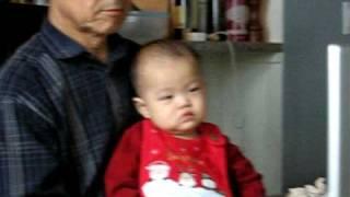 Insoo and Grandfather mesmerized by Pororo DVD