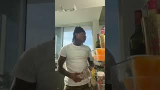 Duke Dennis eating grapes from the refrigerator