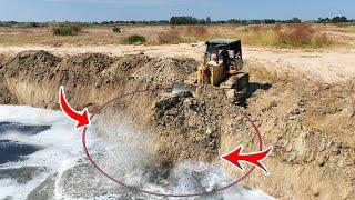 Huge Land Reclamation Process Dump Truck Management Unloading Rock Dirt Bulldozer Pushing Soil