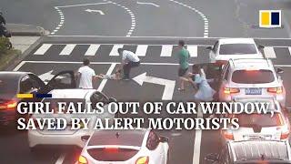 Girl falls out of car window, saved by alert motorists in China