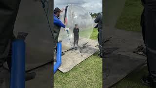 My brother @Cartergamesyt  getting in a Zorbing ball #holidayswithshorts #zorbing