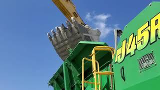 McCloskey J45R Jaw Crusher, Crushing Big Shell Rock to 3 Inch Minus.