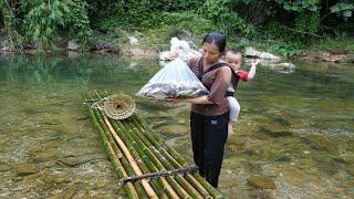 Single mother and her young child - going to the stream to build banks and weave cages to catch fish