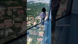 Girl narrowly escapes falling from glass bridge #shortvideo @FAHIMKHANARMAN577