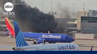 American Airlines flight catches fire at Denver airport