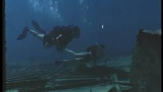 Scuba Divers explore Shipwreck 1970s