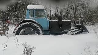 Мтз 82 буксует по глубокому снегу