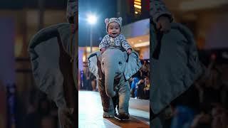 Baby Rides Baby Elephant in Adorable Parade! #short #cute #babyanimals #BeastStudio