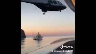 Helicopter takes off from Super Yacht