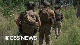 Ukrainian officials say Russian shelling killed at least two people