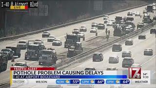 Pothole problem causing delays on I-40 near Airport Blvd