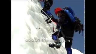 Ice-work in the shadow of Pumori, on seracs of the Everest massif