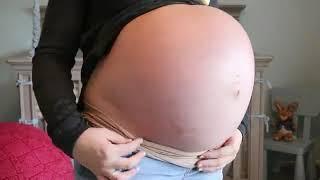 Huge Pregnant Girl Shows off her Huge Belly