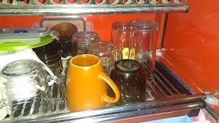 How to drain water from dish cabinet drawer?