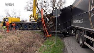 VN24 - GPS say: take this way! Truck trailer slides into ditch on a narrow road