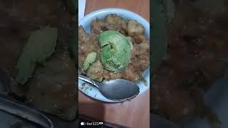 Eating matoke with avocado, MercyNguku The World Traveller 