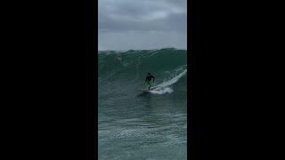 Daredevil surfers brave towering waves brought by Cyclone Alfred