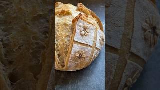 Using oats to make flowers on sourdough is another way to effortless style your bread.