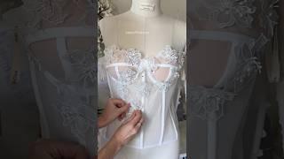 Embroidery of a dress with decorative flowers #handmade #bride #weddinggown #wedding